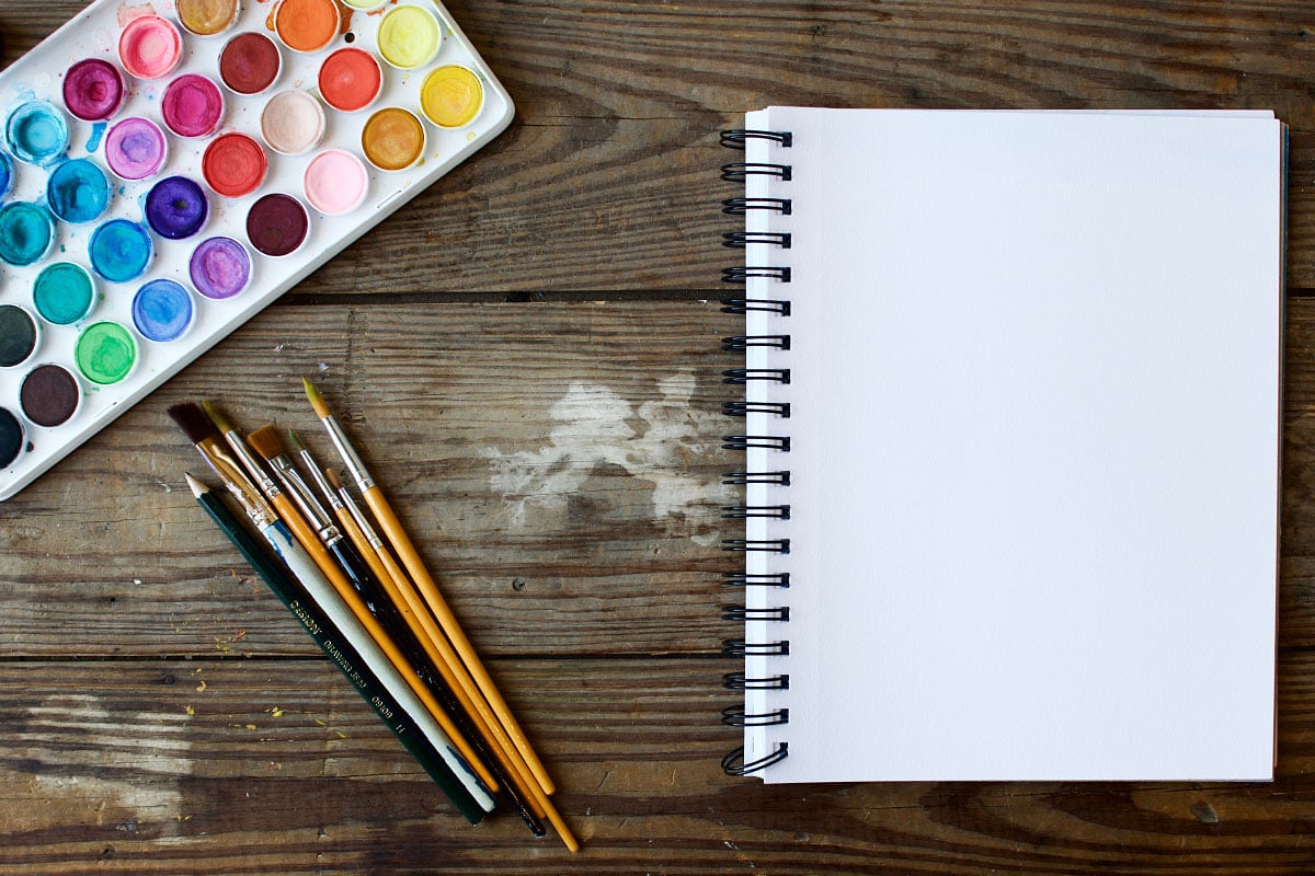Bright watercolor paints and art supplies for creative projects and artistic expression.