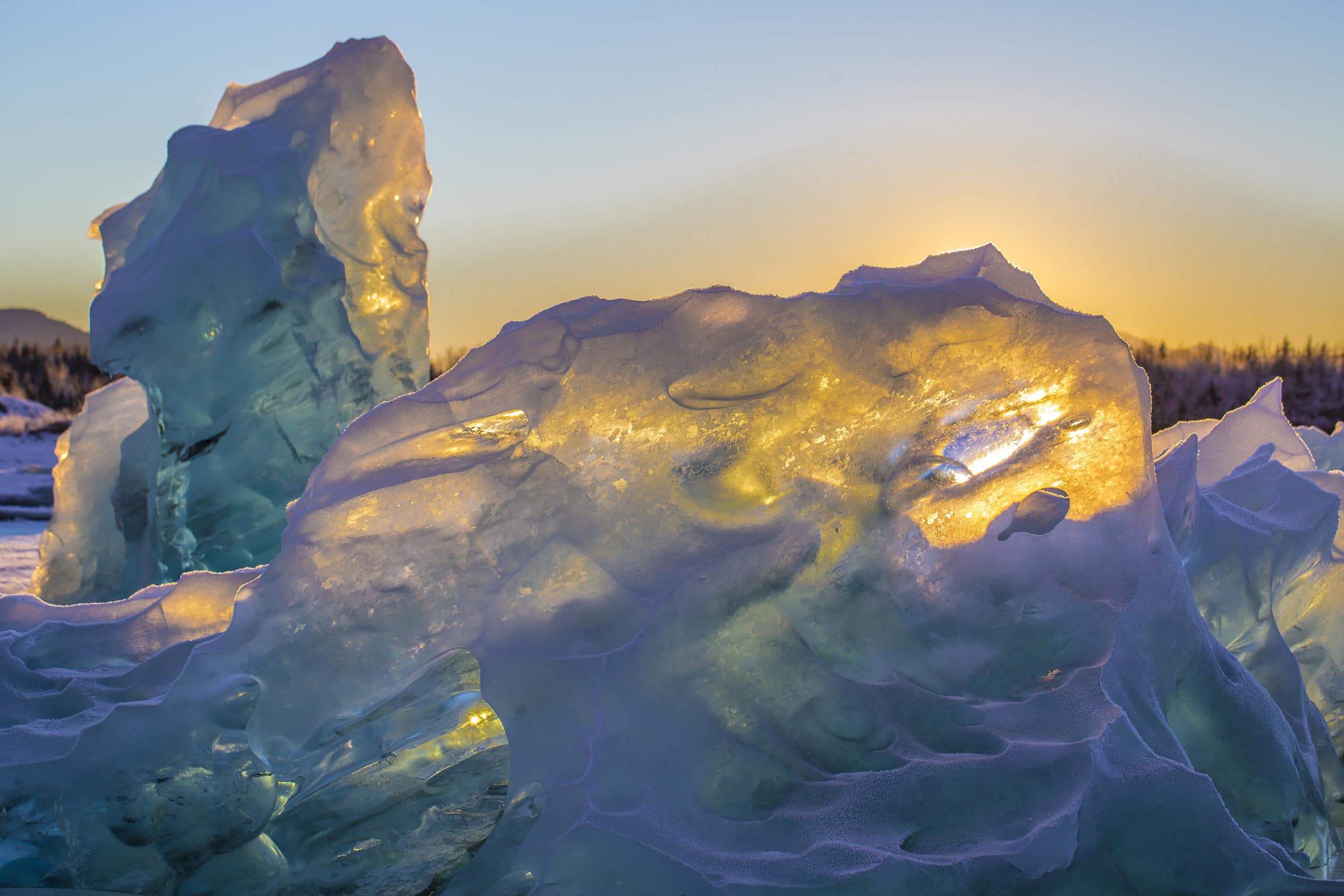 Vivid ice formations glowing in sunset light, capturing the breathtaking beauty of cold Arctic landscapes.