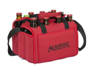 Red neoprene twelve-bottle carrier with black straps and an Alaskan Brewing Co. logo, filled with bottles.