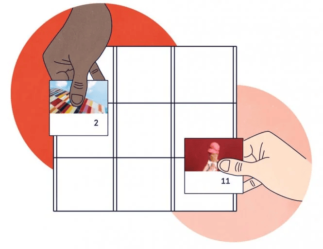Close-up of hands placing photos on a decorative display board, showcasing personalized photo collage ideas.