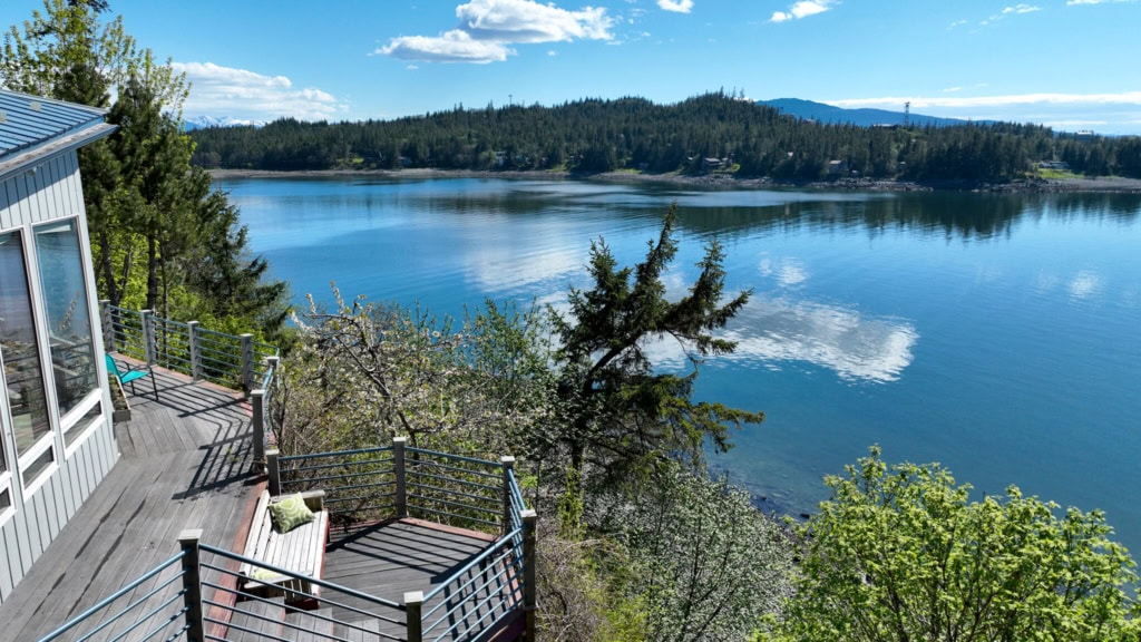 Deck overlooking calm water and distant islands