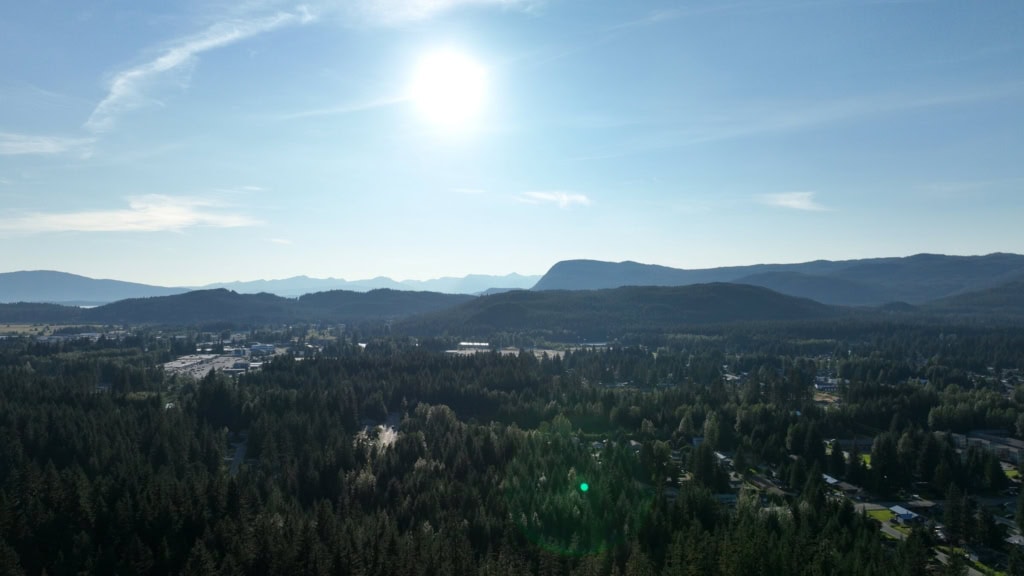 Sun over the Mendenhall Valley and distant mountains